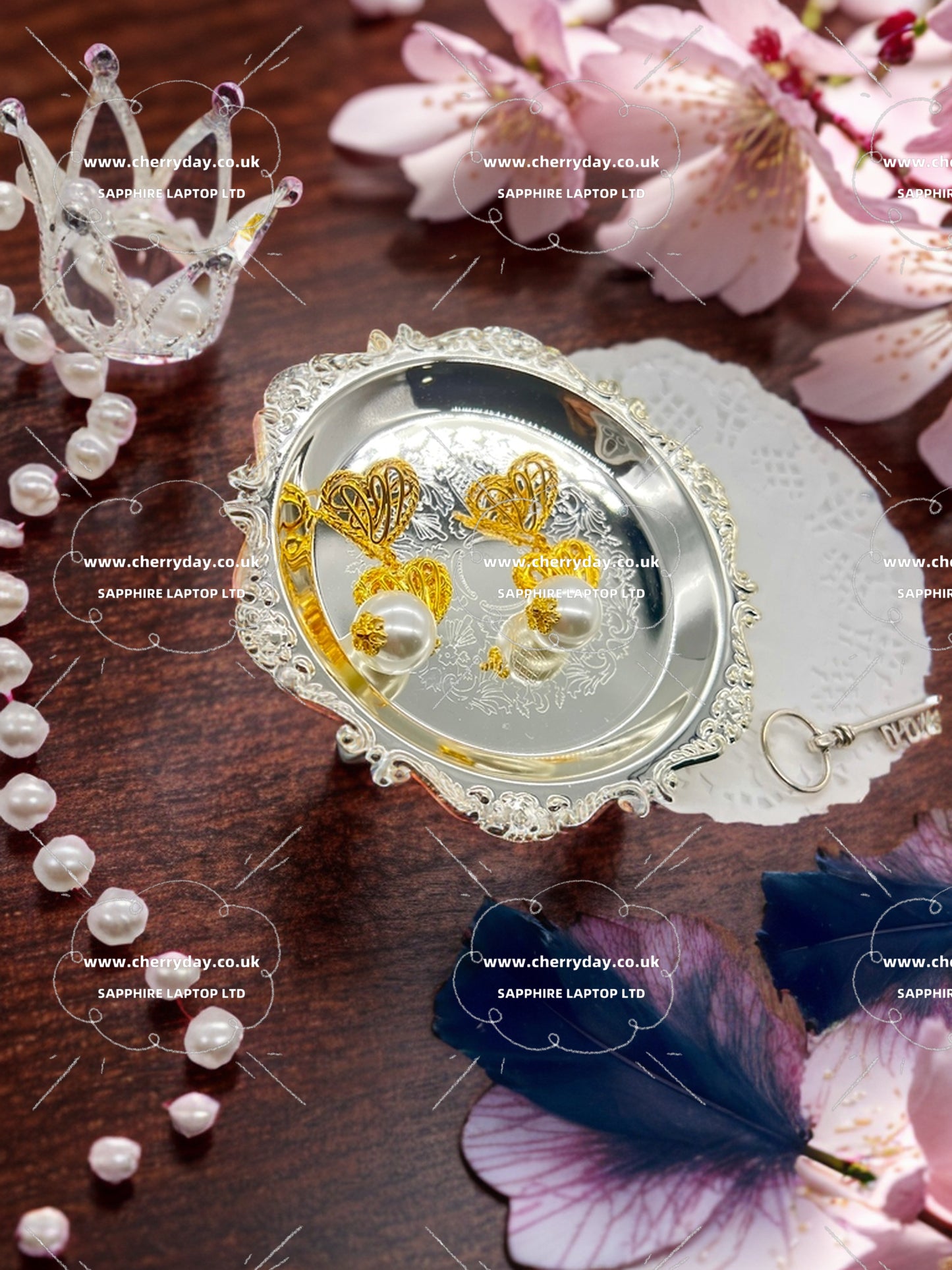 Intertwined heart pearl earrings