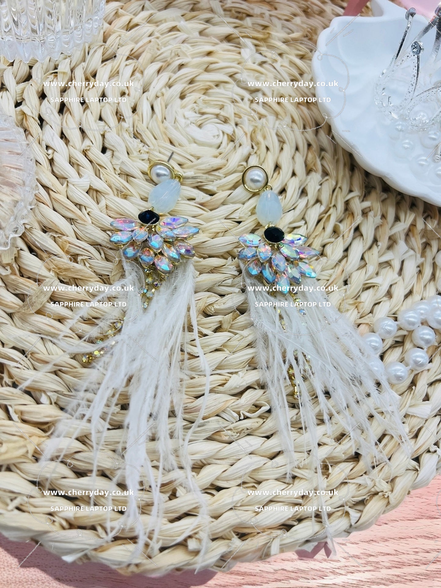 Snow peacock feather earrings