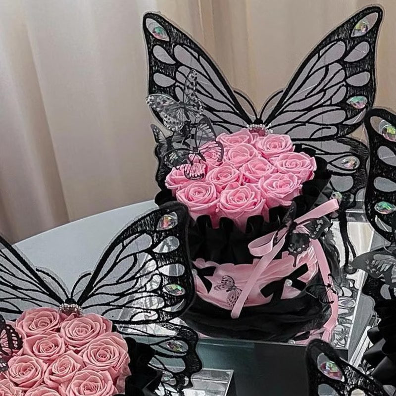 Black Butterfly Resting on Pink Rose