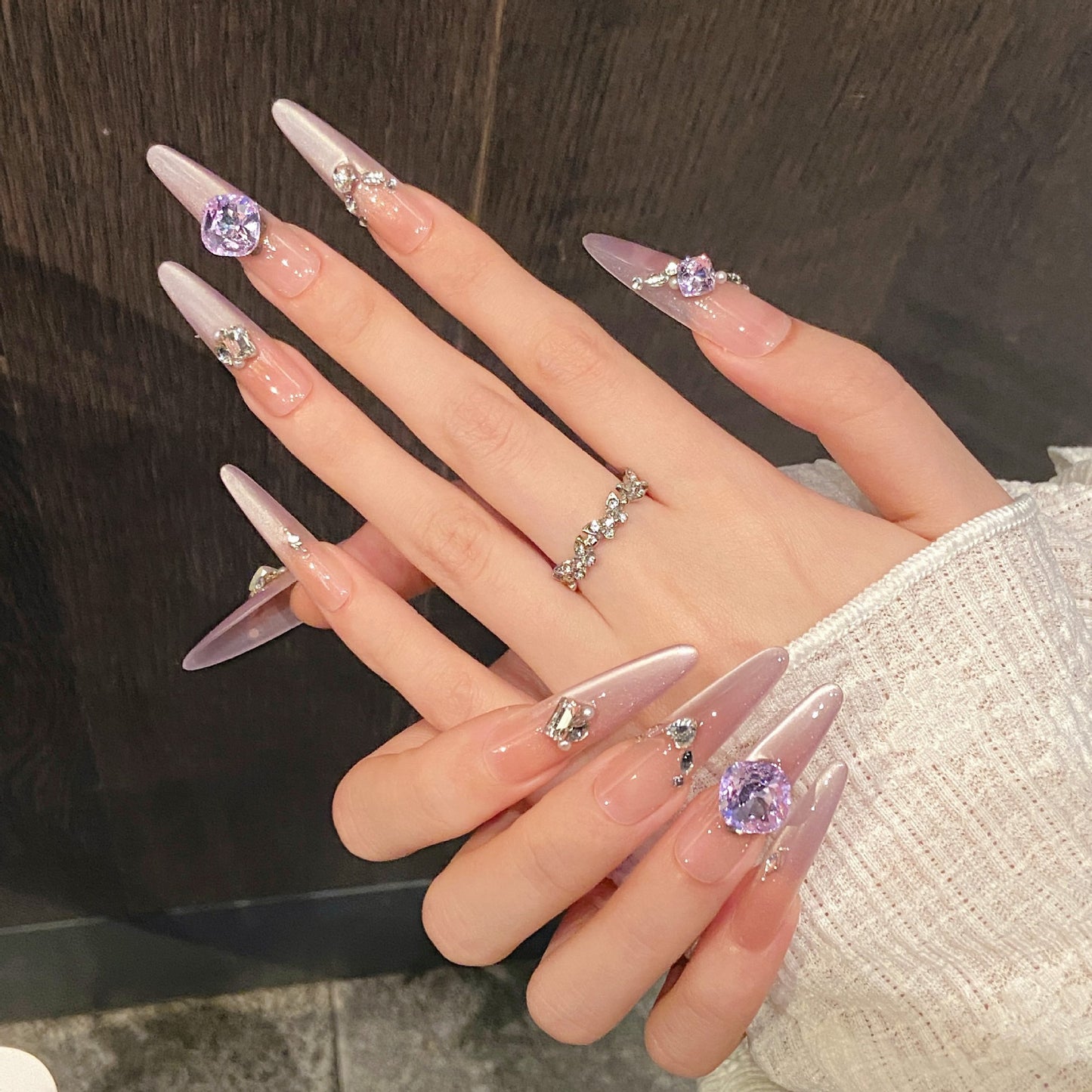 Nails 020-Nail art with purple beveled edges and diamonds